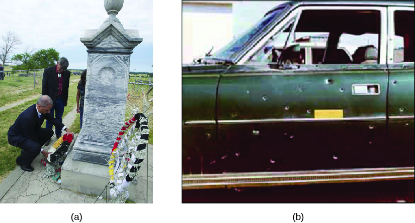 Image A is of three people placing a wreath of flowers in front of a stone monument. Image B is of the side of a truck which is riddled with bullet holes.